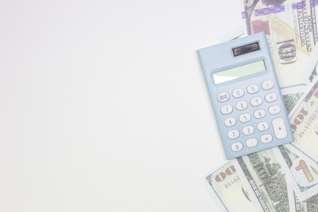 The blue calculator and banknotes on white back ground.の写真素材
