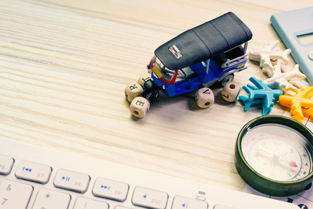 The tuktuk on white  office  table for travel content.の写真素材