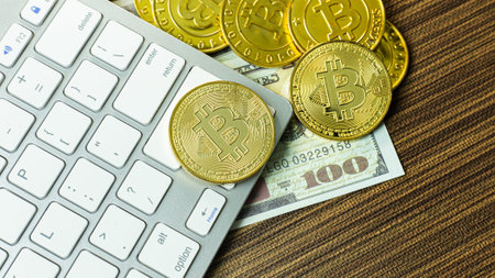 The Bitcoin coin on silver keyboard for  cryptocurrency content.