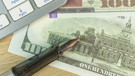 The silver pen on wood table for business  content.の写真素材