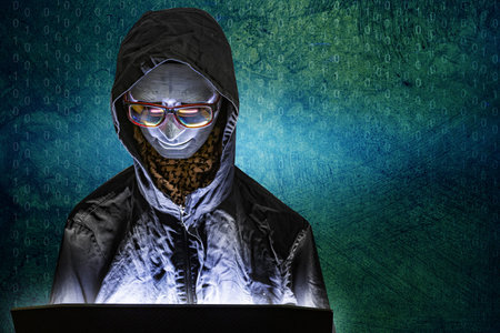 The Mannequin and laptop in dark tone for cyber crime content.