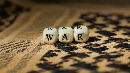 The war on wood cube  on  shemagh  for  military content.の写真素材