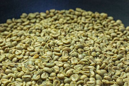 The green coffee raw close up image for food content.の写真素材