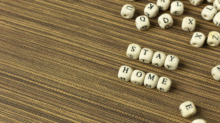 The stay home on wood cube for social distancing content.
