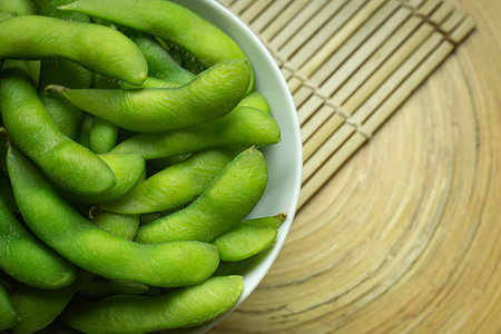 The Edamame  in white bowl top view image for food content.