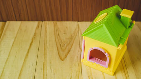 home toy on wood table for property and building content.の写真素材