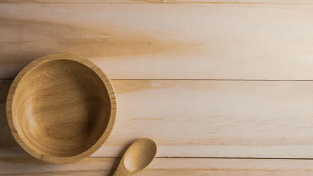 The wood bowl on wooden table for food content.の写真素材
