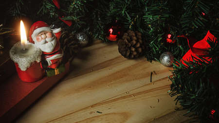 The Santa Claus candle on wood table for Christmas  content.の写真素材