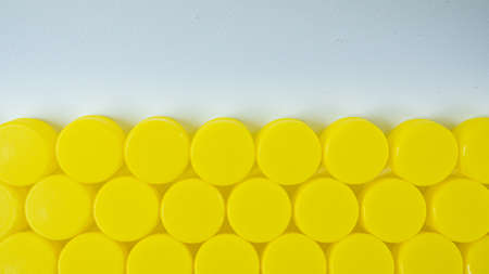 The yellow Bottle  plastic cap for ego background.の写真素材