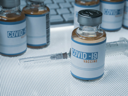 The vaccine covid 19 in bottle for medical content.の素材
