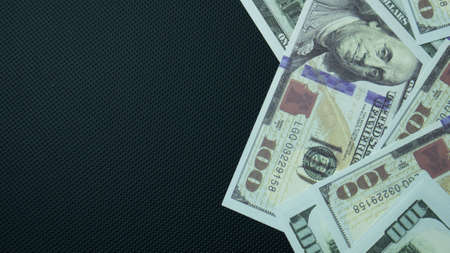 100 dollar banknote on black background for business contentの写真素材