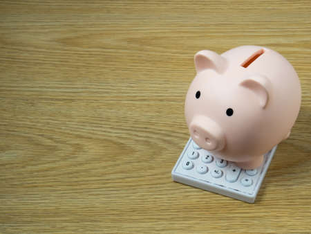 piggy bank on wood table for  Finance or saving money business content.の写真素材