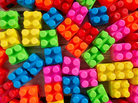 Color toy bricksÂ  on wood table for background or education conceptの写真素材