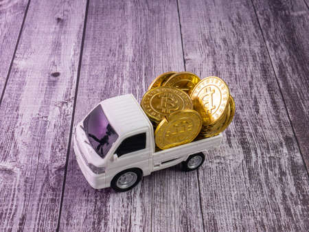 The white van truck and gold coins for business or transport conceptの写真素材