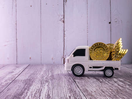 The white van truck and gold coins for business or transport conceptの写真素材