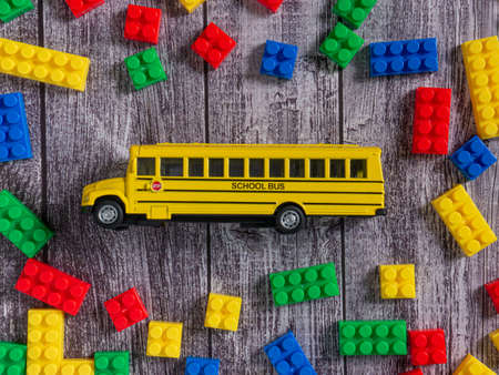 The box plastic puzzle multicolour and school bus  for kid or education conceptの写真素材