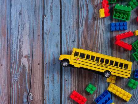 The school bus on wood table for education or transportation conceptの写真素材