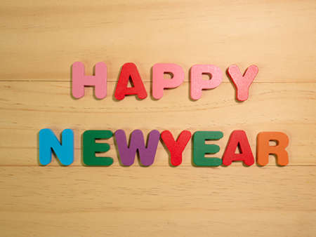 happy new year on  wood texture for background conceptの写真素材