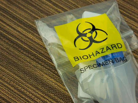 Antigen Test Kit in biohazard garbage for medical or sci conceptの写真素材
