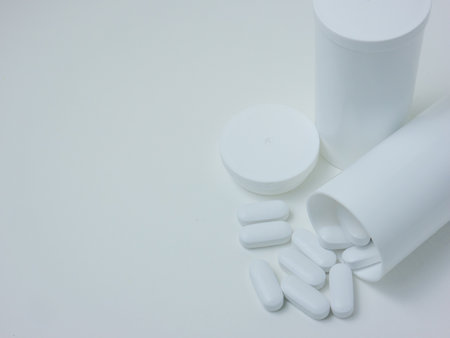 The white pill on wood table for sci or medical conceptの写真素材