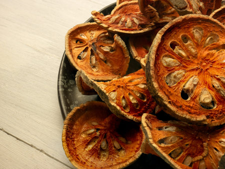 The bael fruit, also known as wood apple, is a tropical fruit native to India and commonly found in...