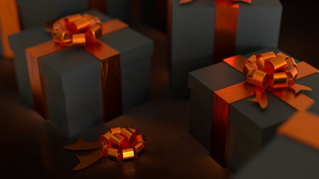 Luxury black gift boxes with shiny orange ribbons and bows, elegant holiday presents for celebration, Christmas, or special occasions, premium background with warm light.の写真素材