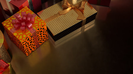 Luxury gift boxes wrapped in gold and red with decorative bows, symbolizing celebration, Christmas, holiday season, birthday, festive presents, and elegant gift giving.の写真素材