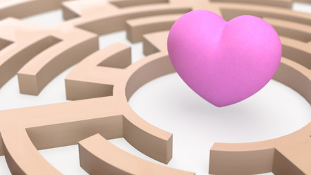 Pink heart floating at the center of a beige maze, symbolizing love, relationships, challenges, and finding the path to the heart.の写真素材