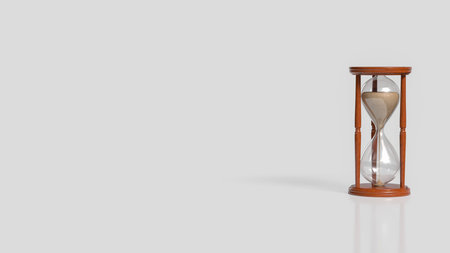 Minimalist image of a classic wooden hourglass with flowing sand, symbolizing time, patience, and...