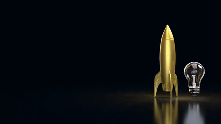 A golden rocket beside a clear light bulb on a dark background, representing innovation, startup growth, creativity, new ideas, technology development, and successful project launches.の写真素材