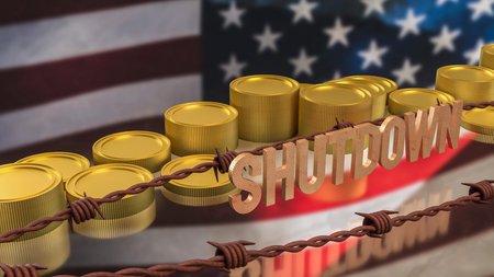 Government shutdown text with barbed wire and stacked coins over United States flag representing...