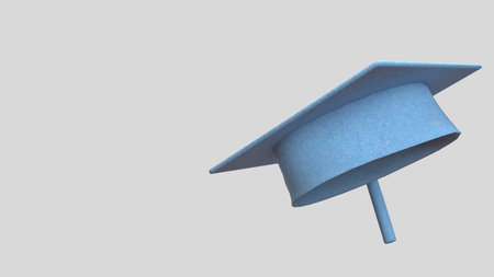Light blue graduation cap isolated on gray background. Academic achievement concept for university success, education milestone, ceremony celebration, and student accomplishment.の写真素材
