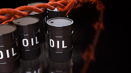 Oil barrels in front of stock market trading screen representing global energy industry crude oil price movement commodity trading investment and financial market analysis conceptの写真素材
