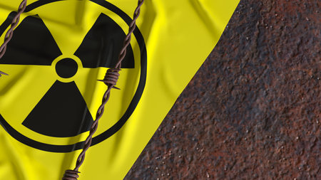 radioactive hazard symbol on yellow warning surface behind rusty barbed wire representing nuclear...