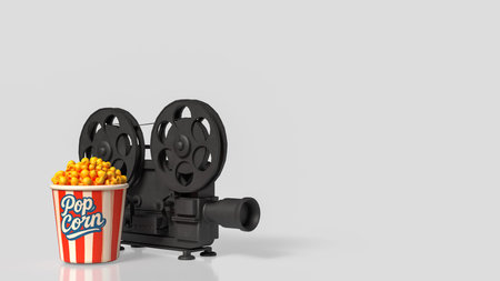 Vintage film camera and popcorn bucket on clean gray background with copy space for cinema movie night entertainment and streaming concept