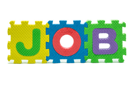 word JOB formed with colorful foam puzzle toy isolated on white blackgroundの写真素材