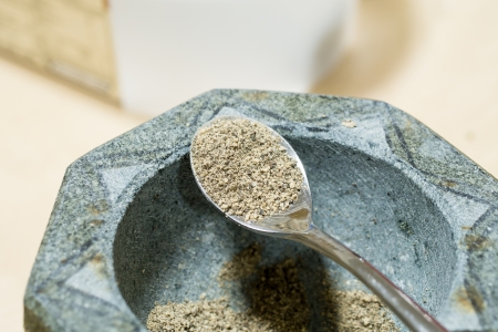 mortar and pestle with pepper の写真素材