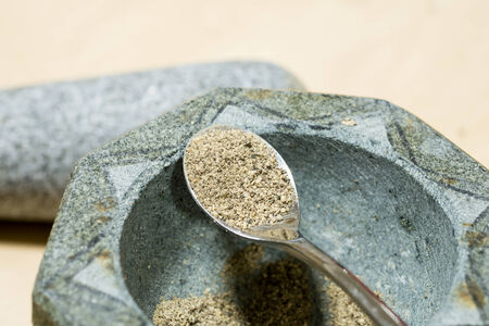 mortar and pestle with pepper の写真素材