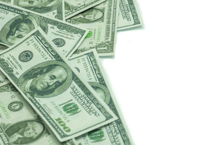One hundred dollars and one dollars pile as background 