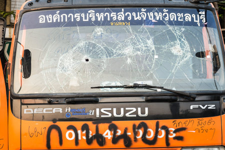 BANGKOK-FEB 22: Car damaged and broken, Thai police clash with anti-government protesters at...
