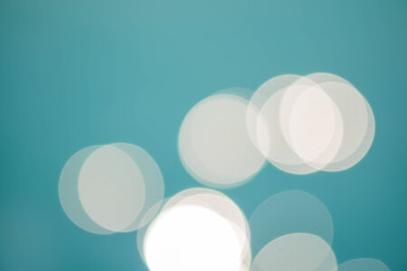 bright colorful sun and sea bokeh backgroundの写真素材