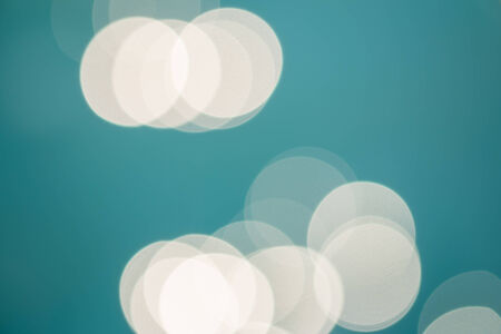 bright colorful sun and sea bokeh backgroundの写真素材