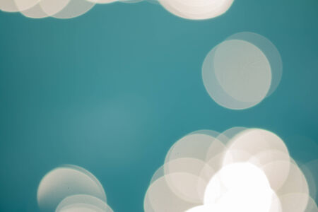 bright colorful sun and sea bokeh backgroundの写真素材