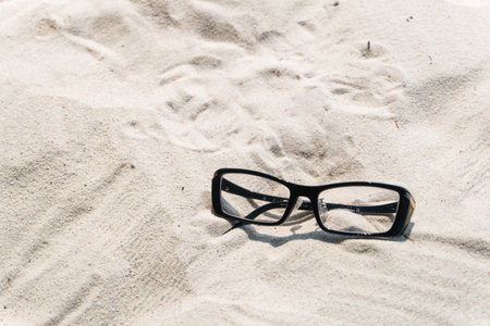 eyeglasses on the sand
