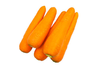Fresh ripe carrots stacked with copy space on white background. Orange fruit colors.の写真素材
