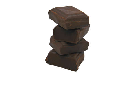 Dark chocolate stacked four pieces on white background.の写真素材