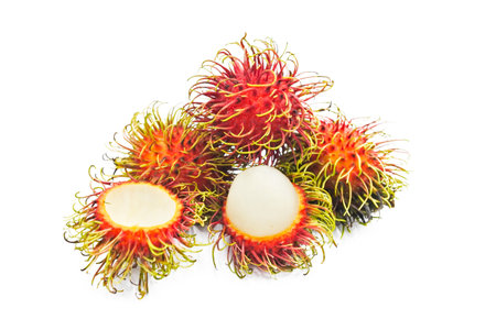 Fresh rambutan with cut halved on white background.の写真素材