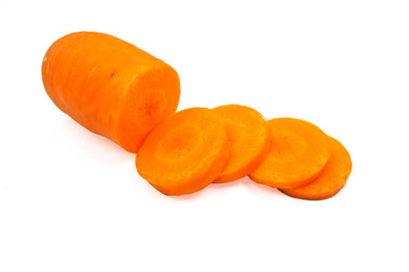 Fresh carrots cut sliced on white background.の写真素材