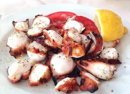 Grilled Octopus with lemon and tomato Mykonos Greeceの写真素材