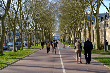 Local people and tourists are walking along the walkway near Versailles Palace, France.のeditorial素材